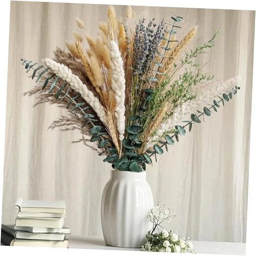 Dried flower bouquet with pampas grass, lavender, eucalyptus in a ceramic vase