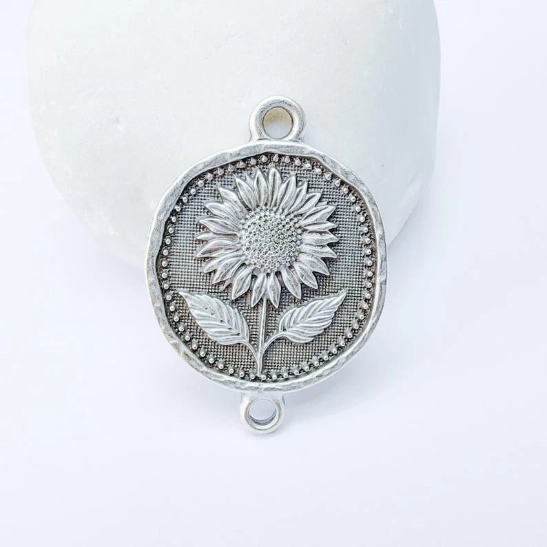 Round sunflower connector charm pendant with engraved flower and leaf, silver-tone metal
