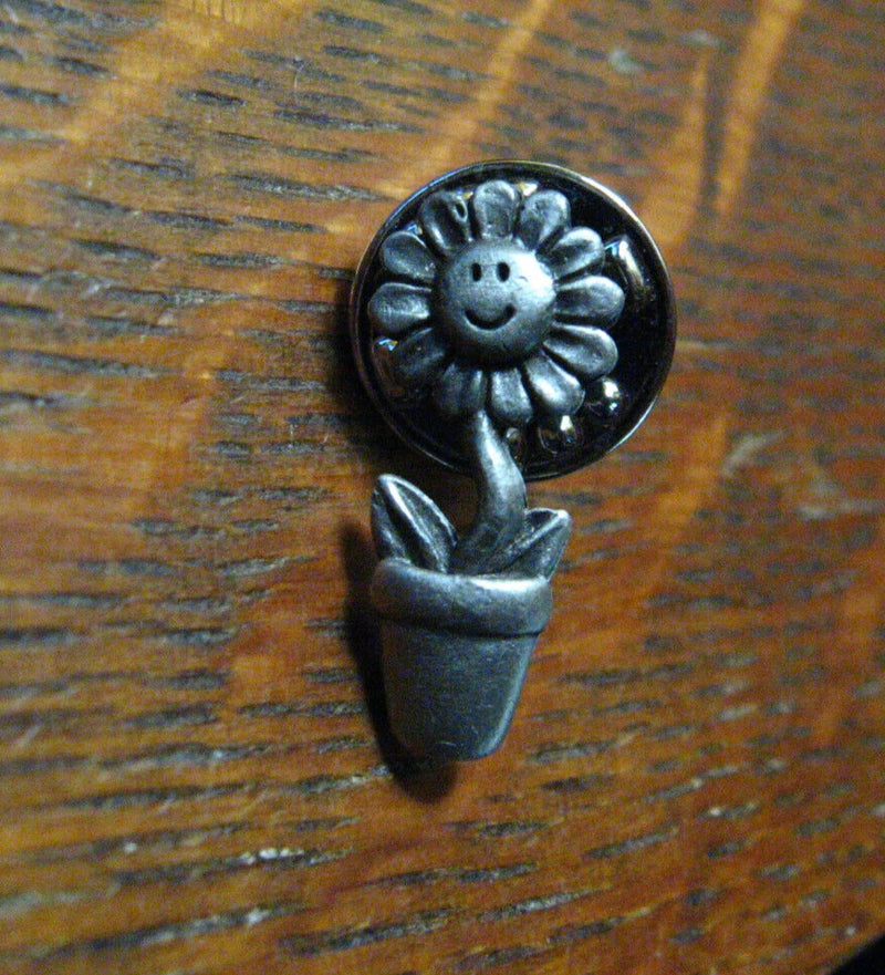 Pewter potted smiling sunflower lapel pin with a cute face in a small pot