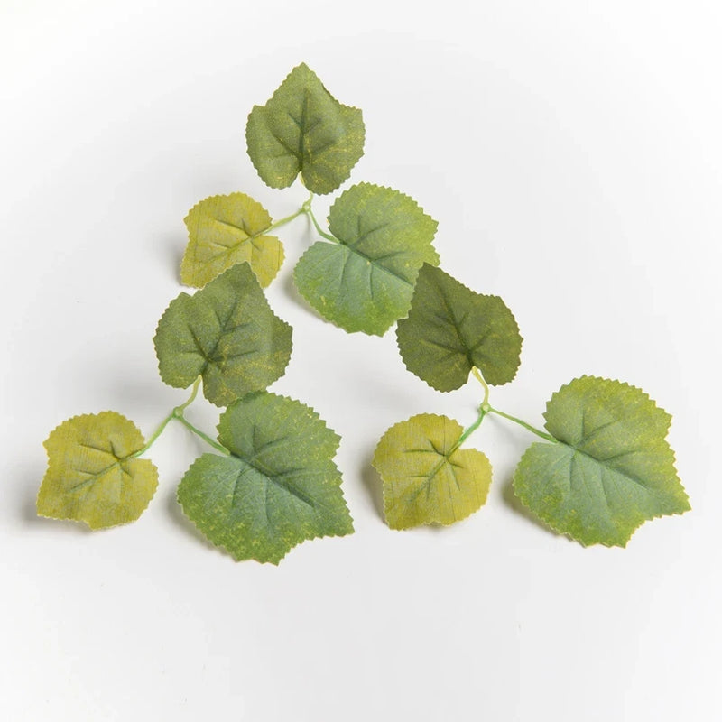 Artificial maple leaf plant sprigs with green and yellow leaf clusters on stems