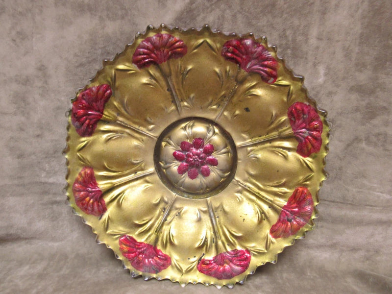 Ornate gold glass low bowl with red carnation floral medallion and scalloped edge