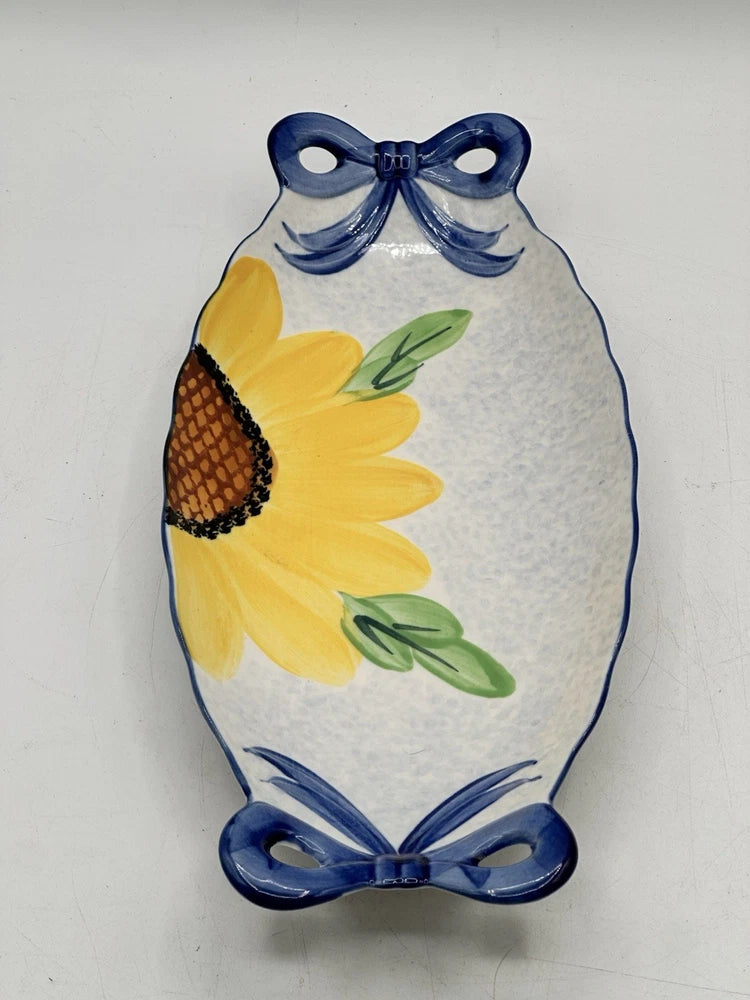 Sunflower ceramic appetizer dish with blue bow handles and yellow flower design
