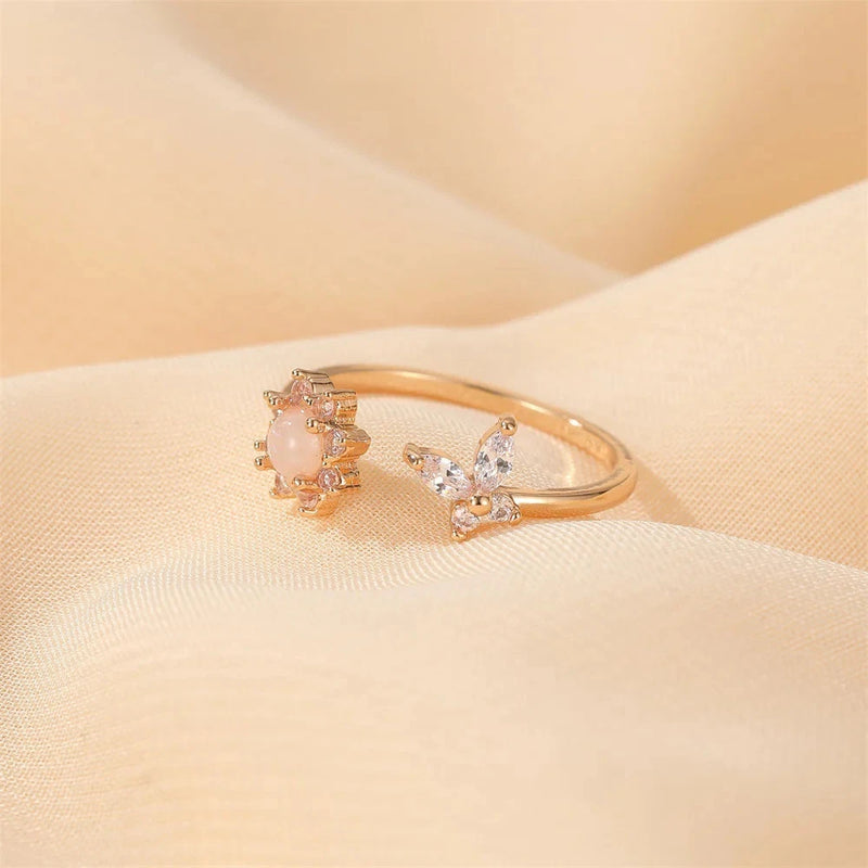 Copper ring with sunflower motif, pink center stone and clear crystal accents
