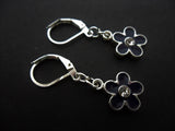 A PAIR PRETTY BLACK ENAMEL DAISY FLOWER THEMED DANGLY LEVERBACK HOOK EARRINGS. Daisies