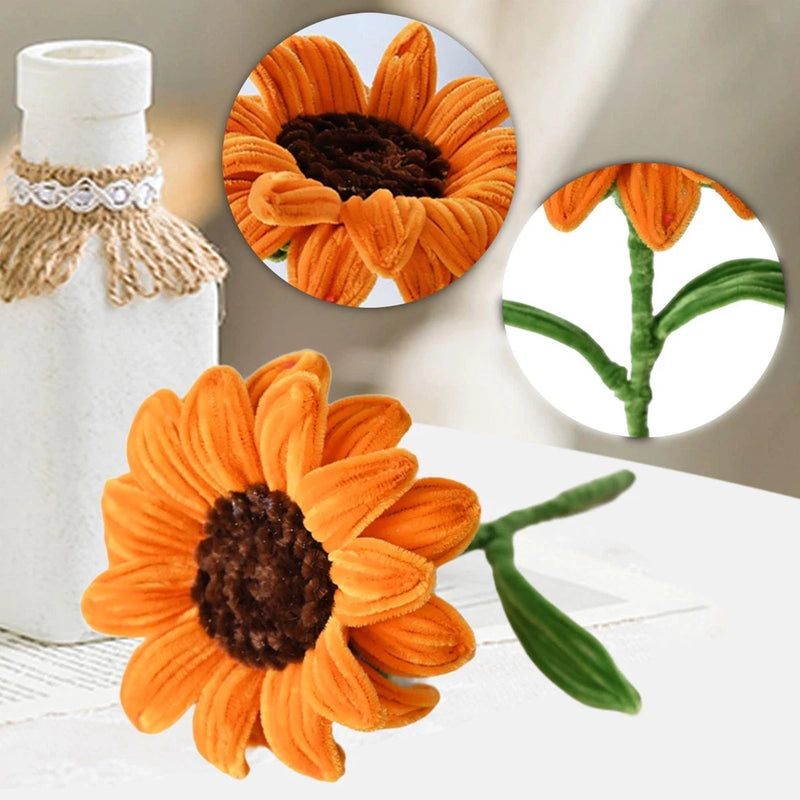 Artificial sunflower decoration with orange ruffled petals, dark center, green stem and leaves