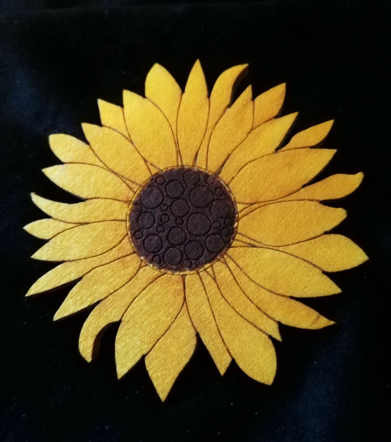 Sunflower brooch with yellow petals and dark round center