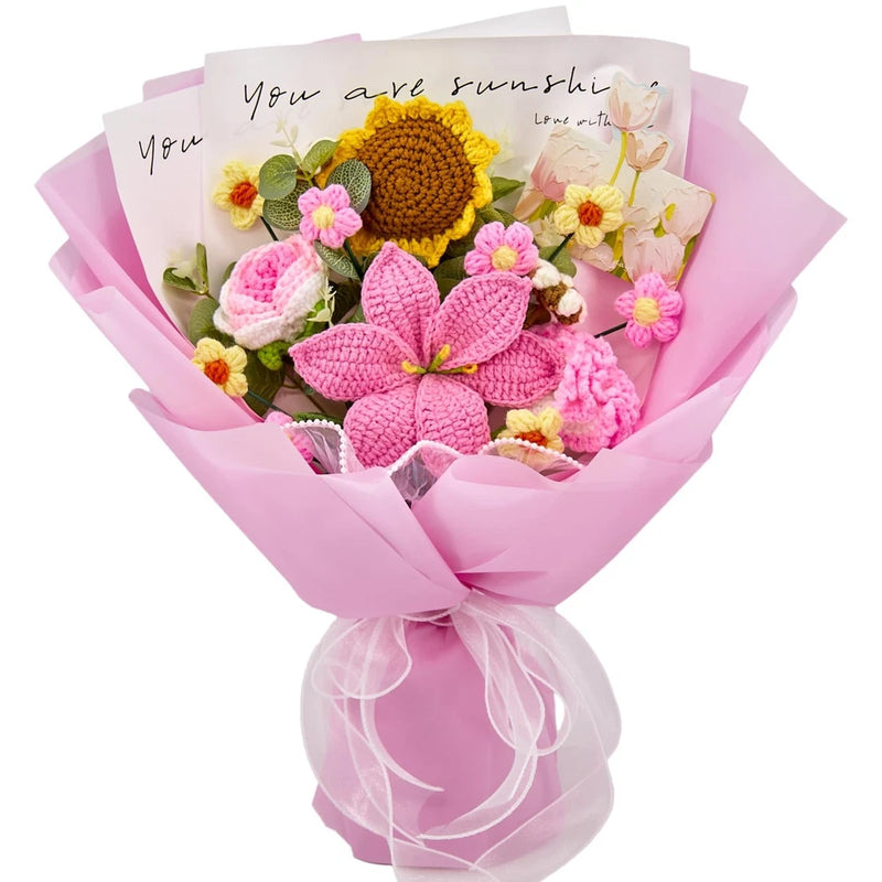 Pink crochet flower bouquet with knitted blossoms and yellow sunflower roses, wrapped gift