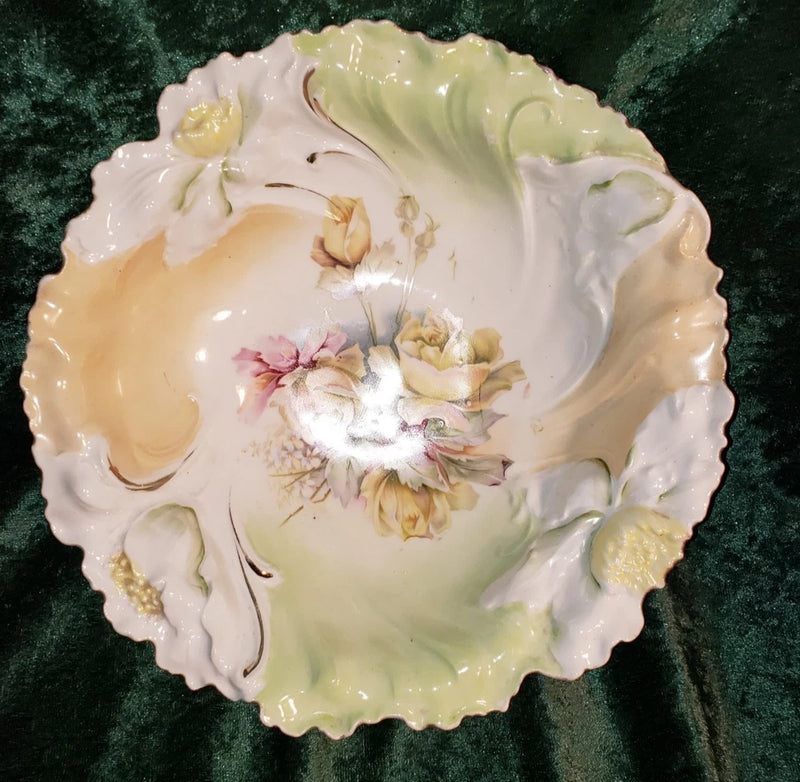 Antique porcelain serving bowl with scalloped rim, painted roses and gold accents