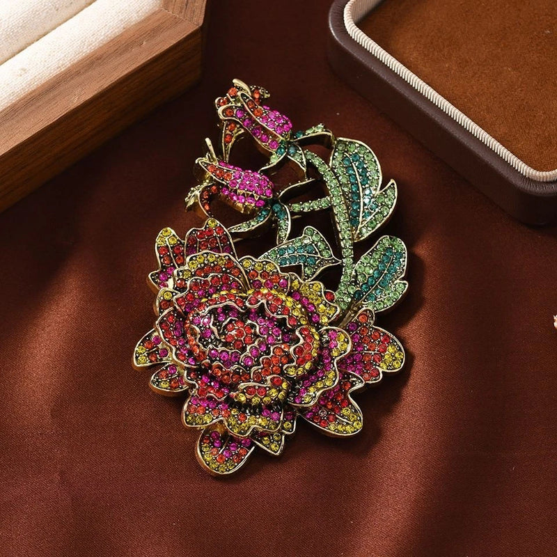 Multicolor rhinestone floral peony brooch pin with leaf details, gold-tone frame