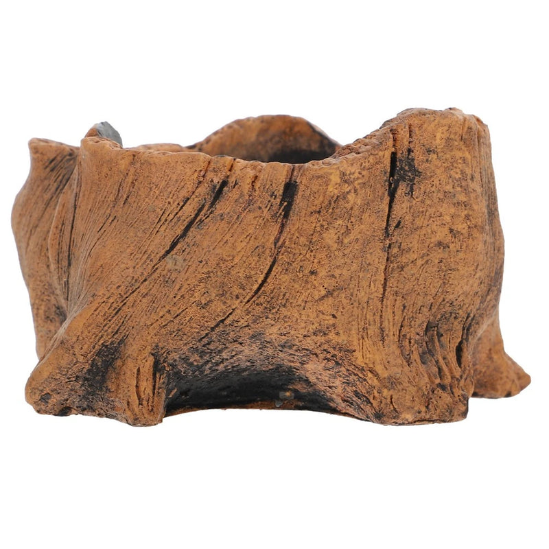 Small rustic brown cement planter pot with carved ridges and uneven lip