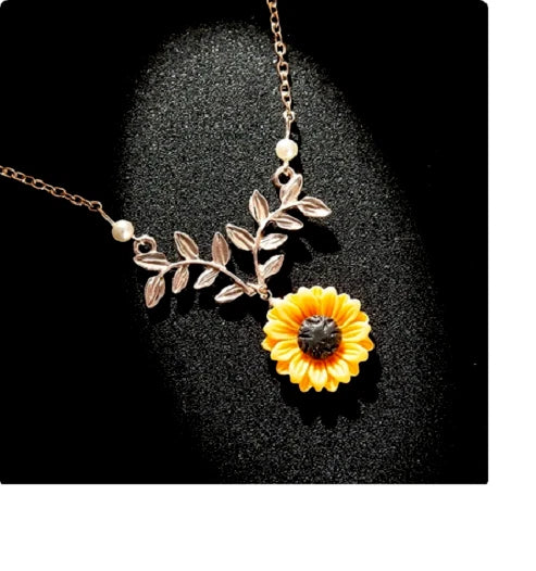Sterling silver sunflower pendant necklace with leaf branch charm and small pearl accents on chain