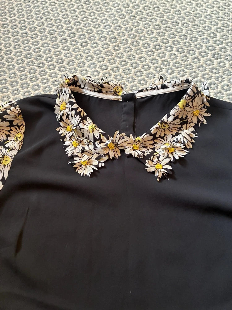 Black blouse with beaded sunflower collar and neckline trim