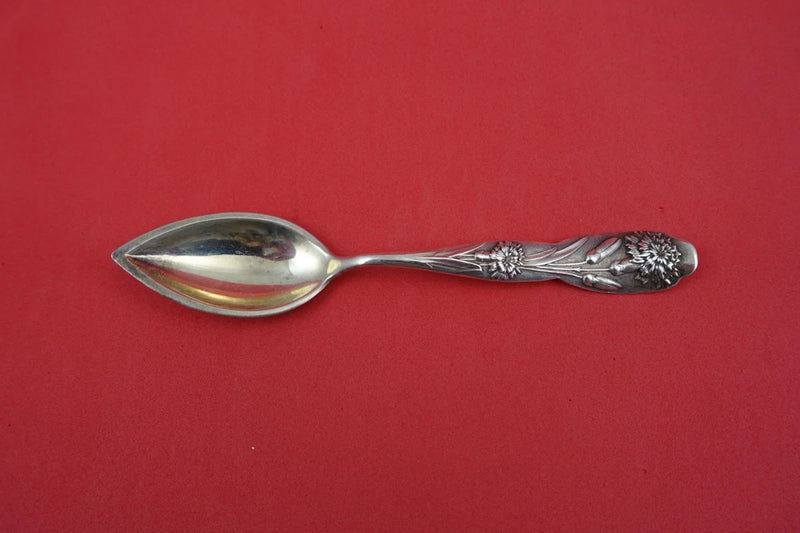 Sterling silver Grapefruit spoon with floral engraved handle, reflective polished finish