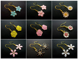A PAIR OF PRETTY ENAMEL DANGLY FLOWER DAISY SUNFLOWER EARRINGS. Sunflower
