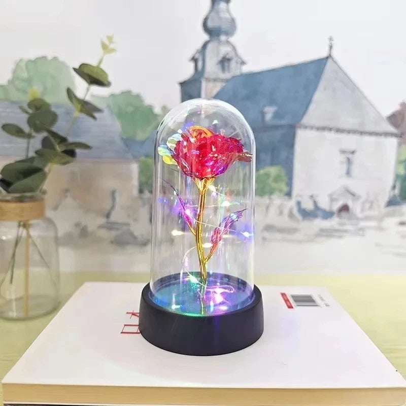 Light-up rose under clear glass dome with LED glow base, decorative gift