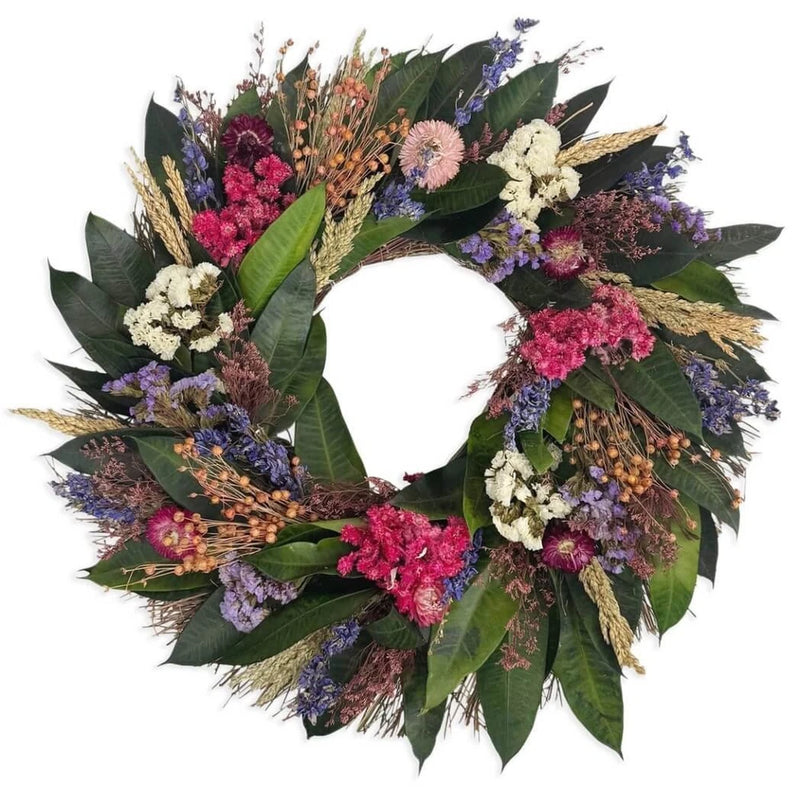 Fuchsia floral wreath with dried blooms and leaves in purple, pink, and tan
