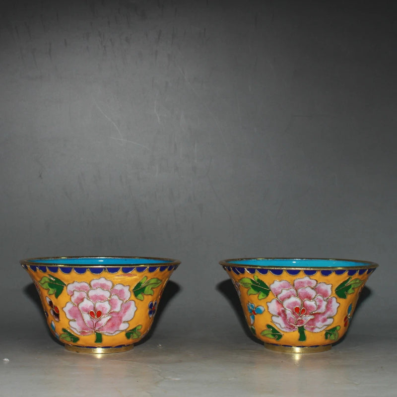 Pair of cloisonne peony pattern bowls with blue rims and colorful floral enamel
