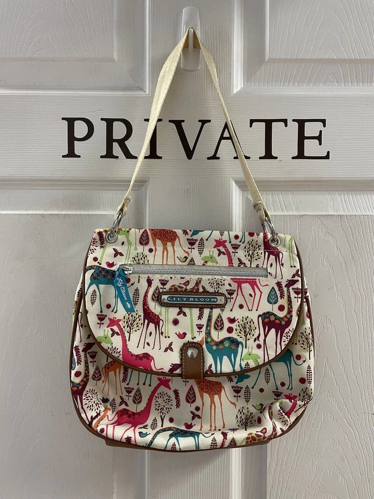 Colorful shoulder purse with giraffe and floral print, front flap and zip pocket, GC. Lily