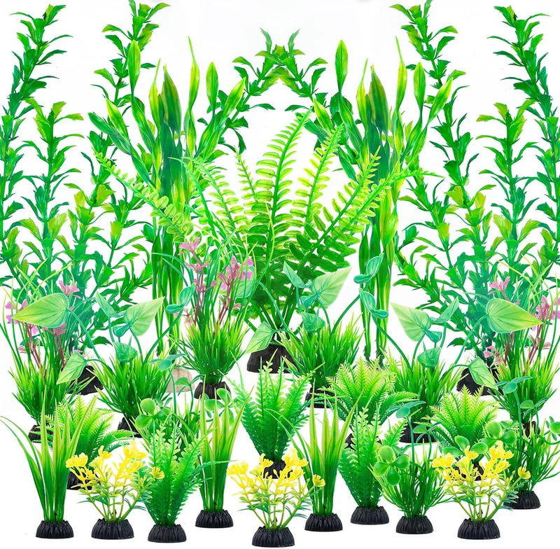 Set of artificial green plastic aquarium plants with black weighted bases