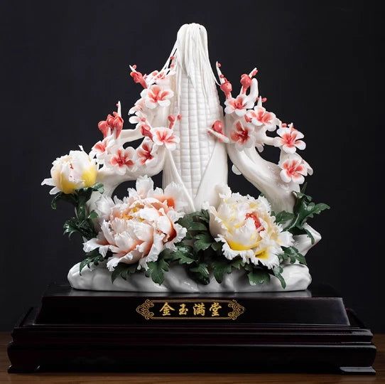 White porcelain peony flower branch sculpture with pink blossoms and dark wooden base