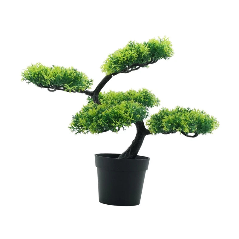 Artificial bonsai tree with green foliage in small black pot