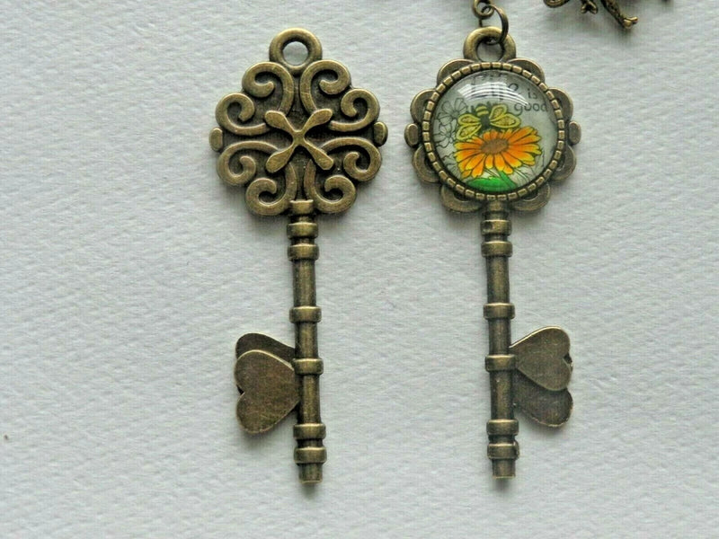 Sunflower key bee key chain bag charm, bronze-toned key shapes with round sunflower pendant