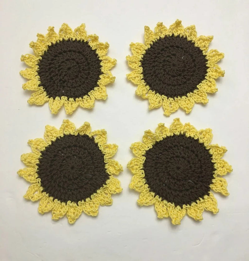 Set of 4 crochet sunflower coasters with dark centers and yellow ruffled petals