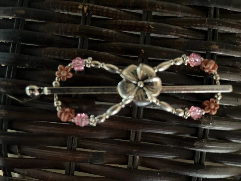 Silver hair flexiclip with pink and peach beaded flower cluster and swirl centerpiece