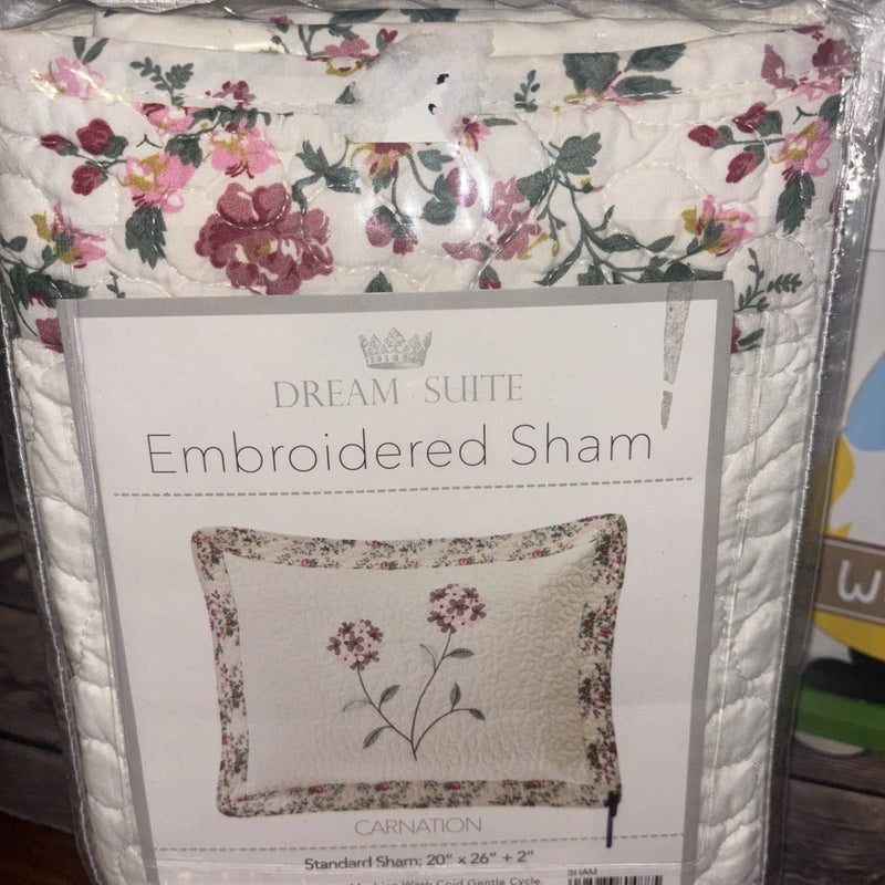 Embroidered pillow sham with pink and burgundy carnation flowers, quilted border