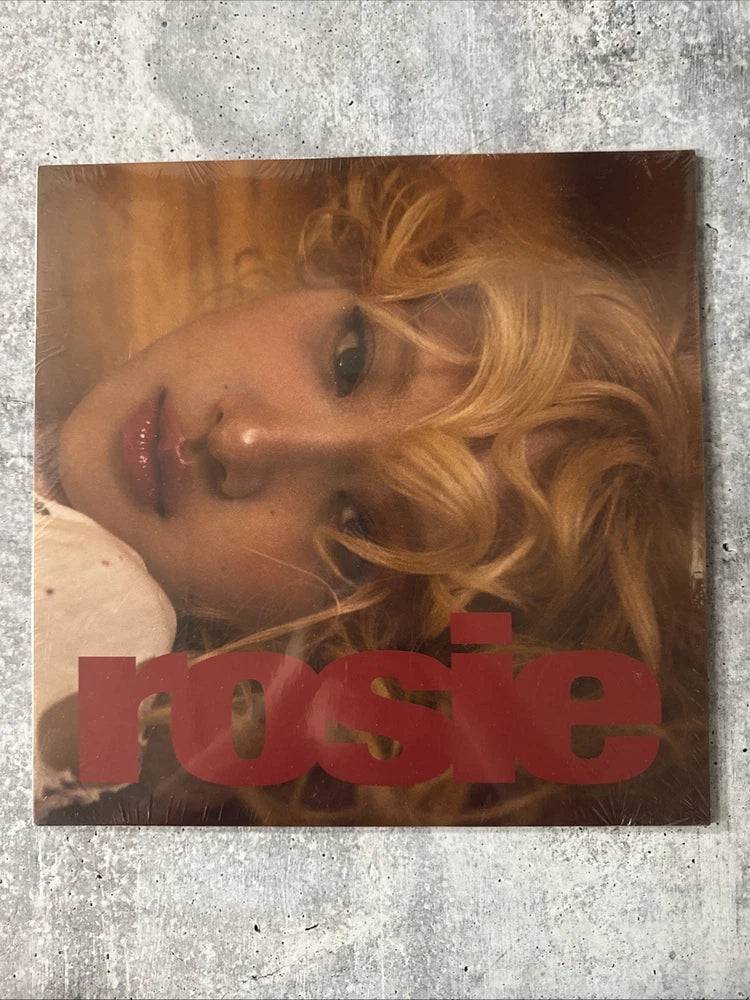Vinyl LP record cover with close-up blonde woman portrait and rose-themed design