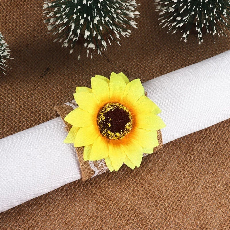 Sunflower napkin ring with yellow fabric flower on folded white napkin