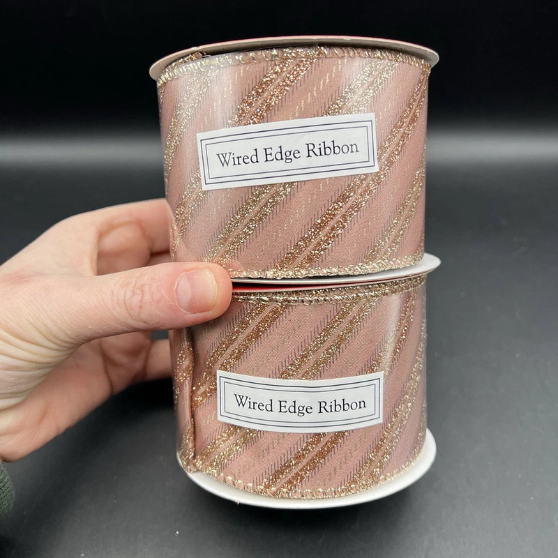 Rose gold metallic glitter wired-edge ribbon roll, pink tone with diagonal stripe texture