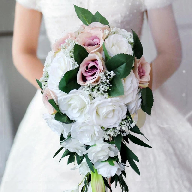 Vintage artificial peony bouquet with white and pink blooms and green leaves