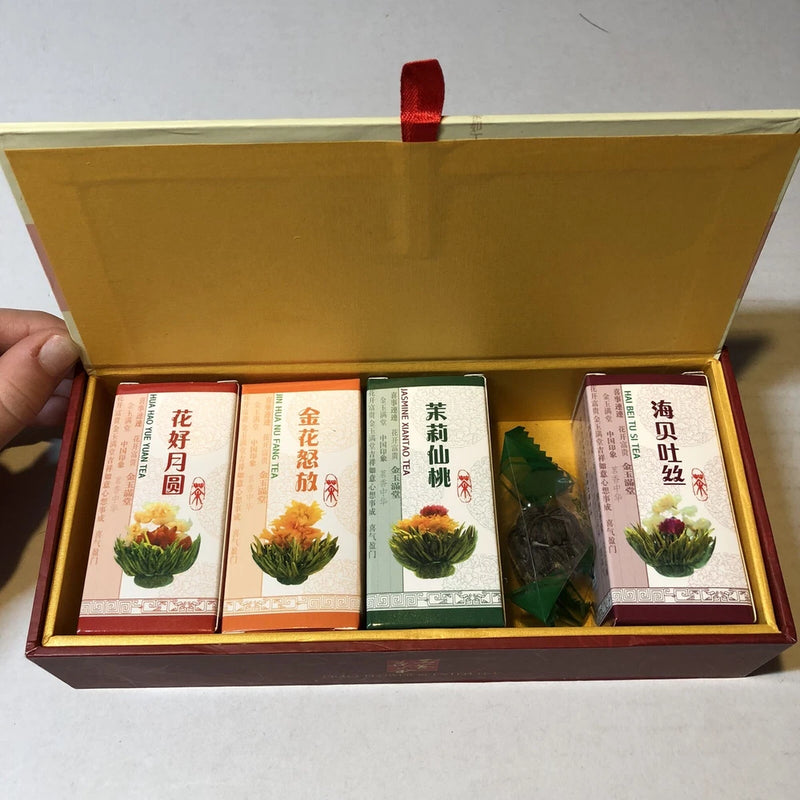 Dried flower tea gift set, assorted tea cartons in open wood box