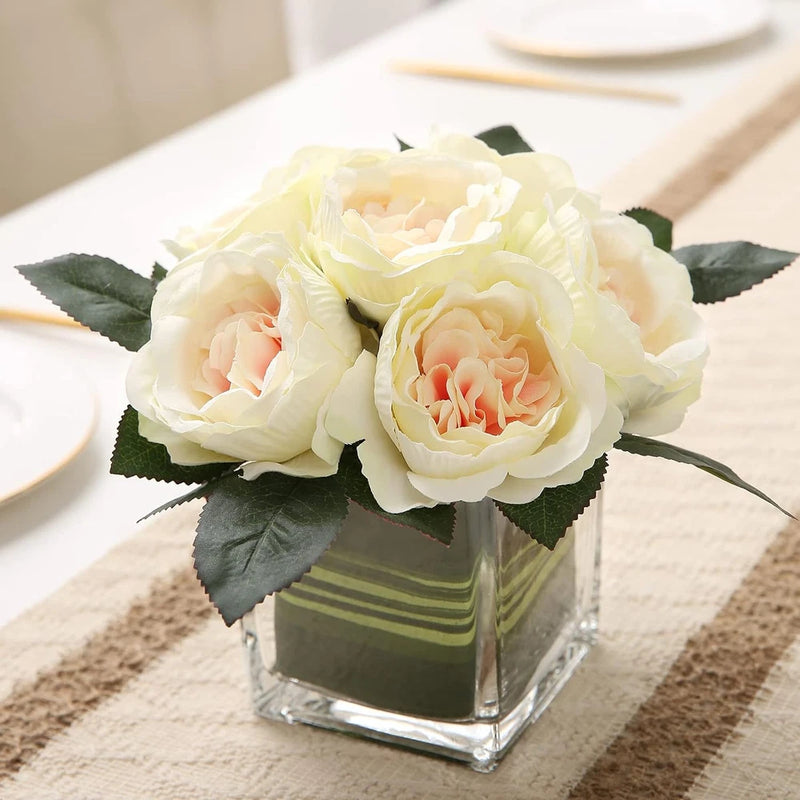 Champagne faux peony silk flower centerpiece with three cream blooms in square glass vase