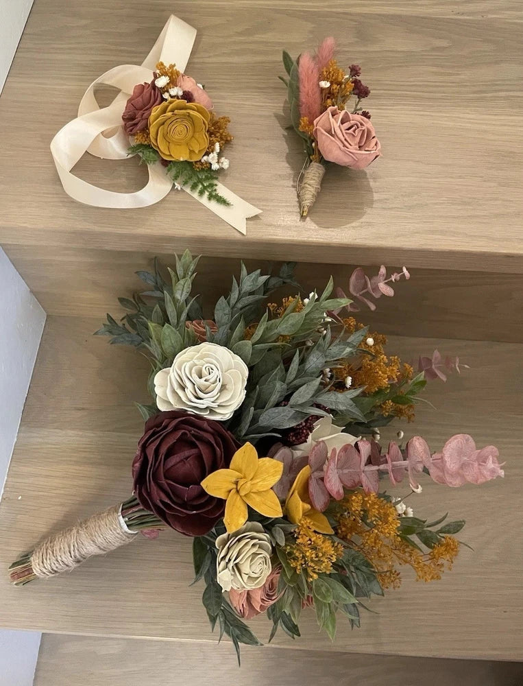 Bridal wood flower bouquet with burgundy, pink, cream, and yellow blooms