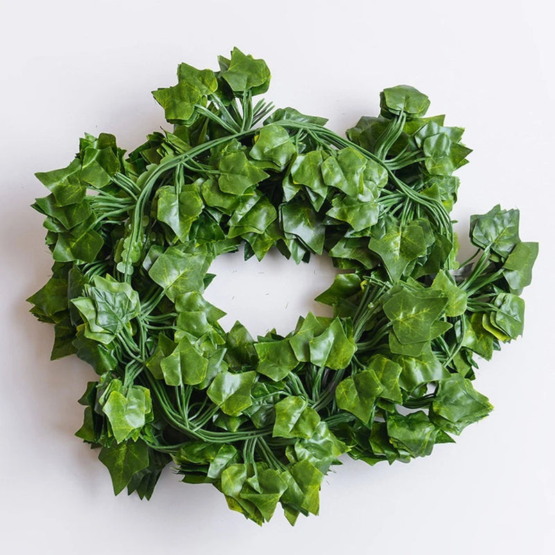 Artificial green leaf vine garland wreath, circular with layered plastic leaves