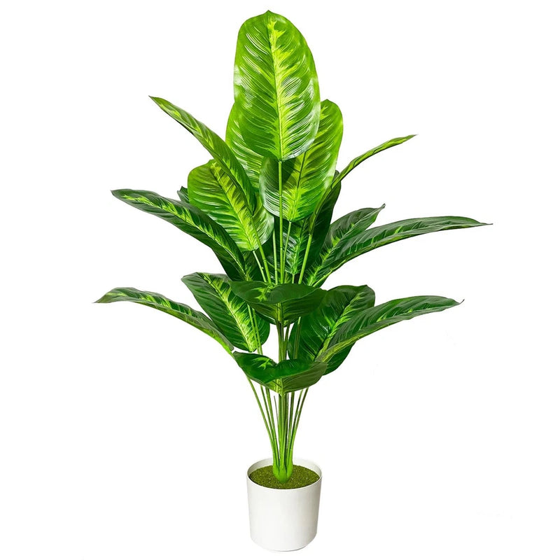 Artificial areca palm plant with bright green leaves in a white pot