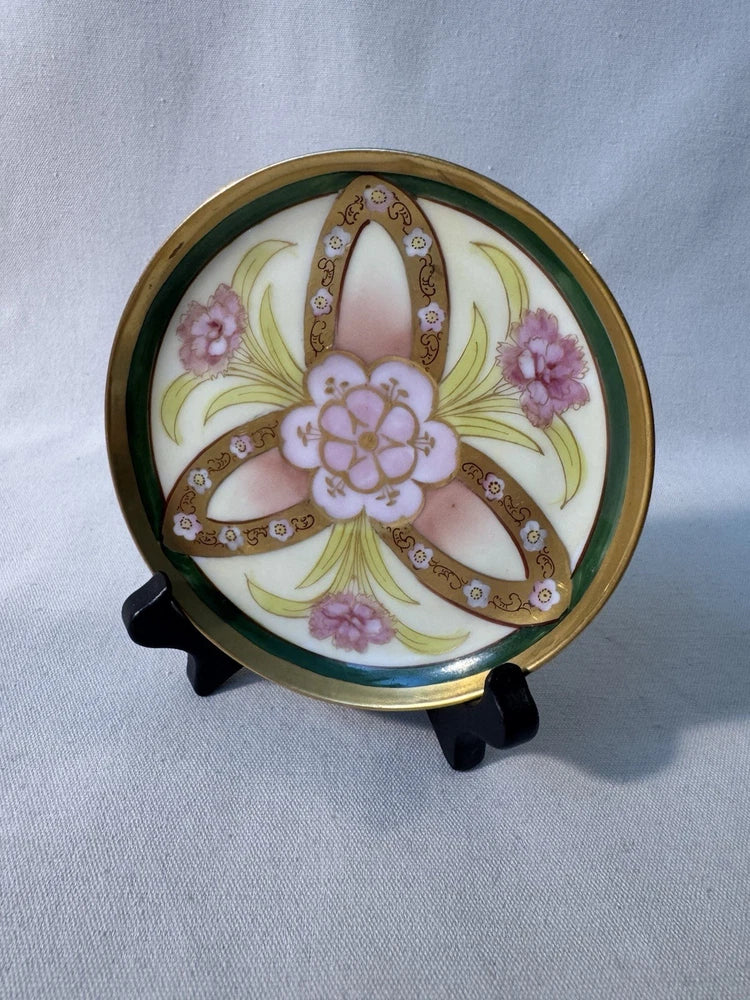 Antique porcelain dish with hand-painted carnations and gold-trimmed rim