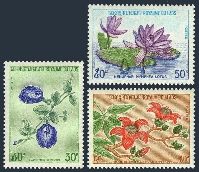 Set of four vintage flower postage stamps with blue and purple lotus blooms