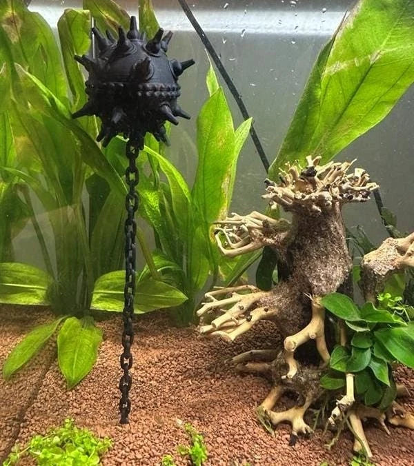Aquarium floating naval mine ornament with chain, black spiked design