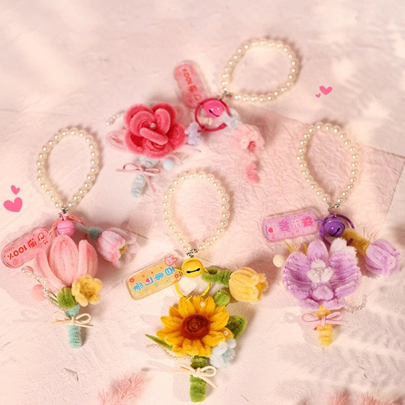 Assorted handmade flower ornaments and keychains with bead loops, pink, yellow, purple