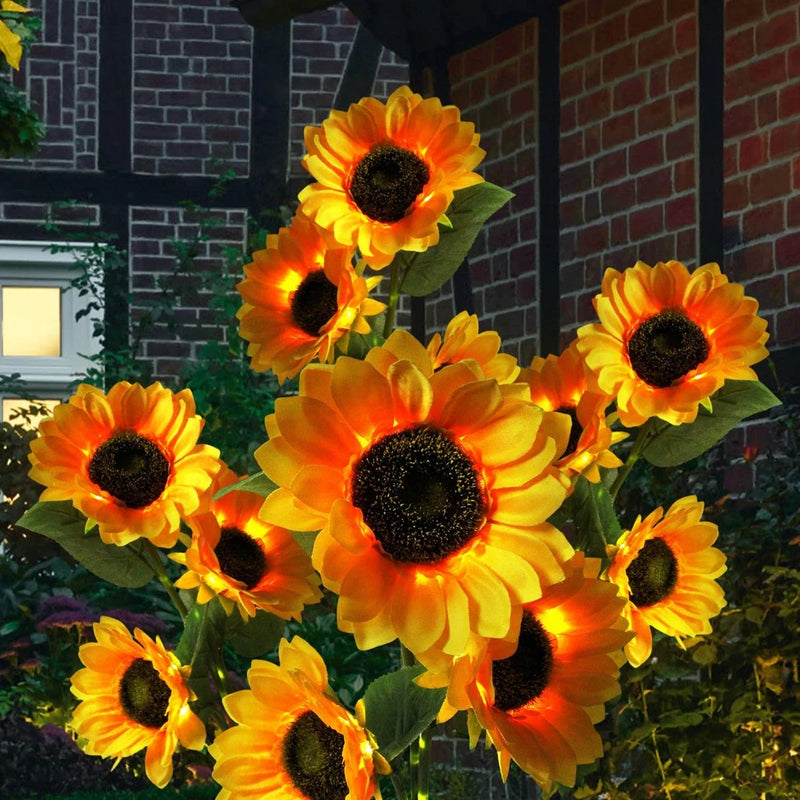 Sunflower solar garden lights with glowing petals and dark centers for outdoor use