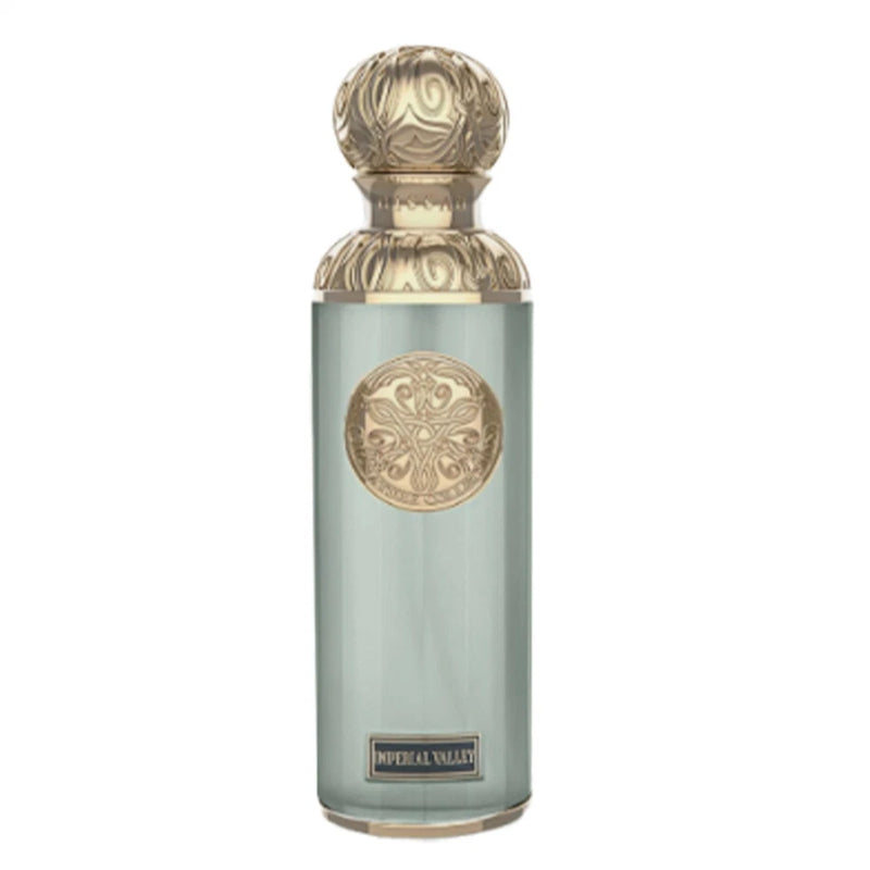 Light teal fragrance spray bottle with gold cap and embossed logo
