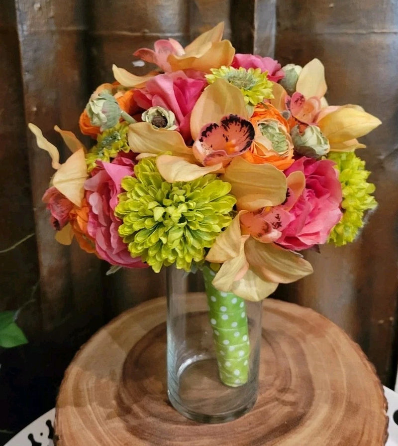 Colorful silk bouquet with pink, orange, yellow, and green flowers; white green polka-dot handle