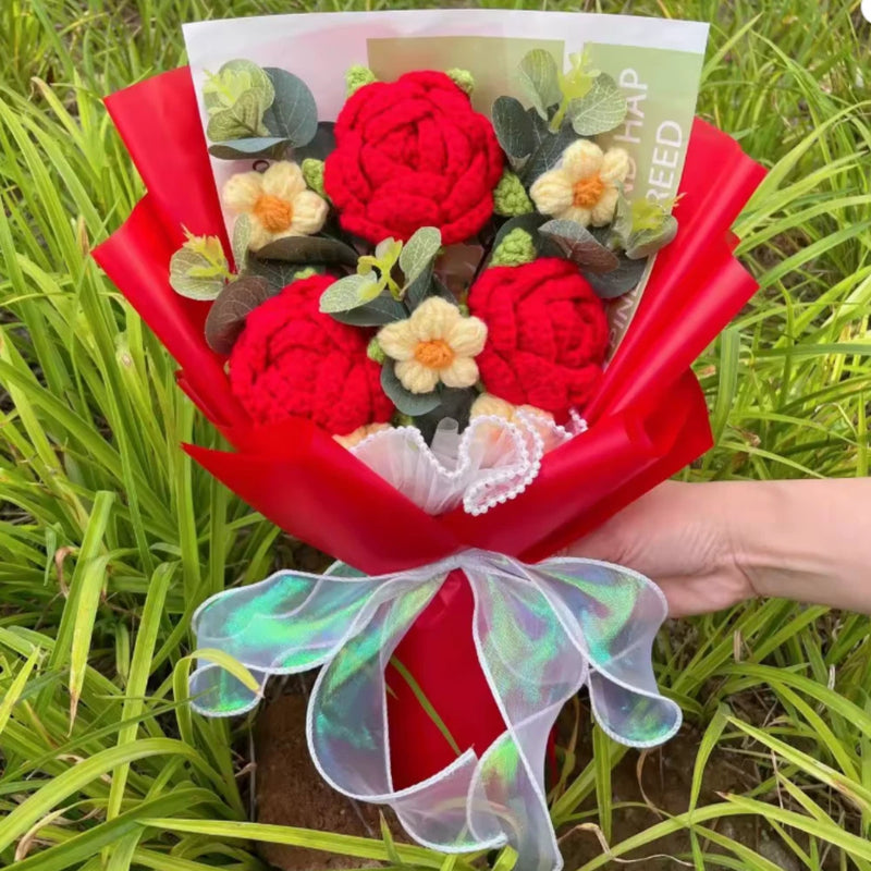 Crochet sunflower and rose bouquet gift wrapped with red paper and sheer bow ribbon