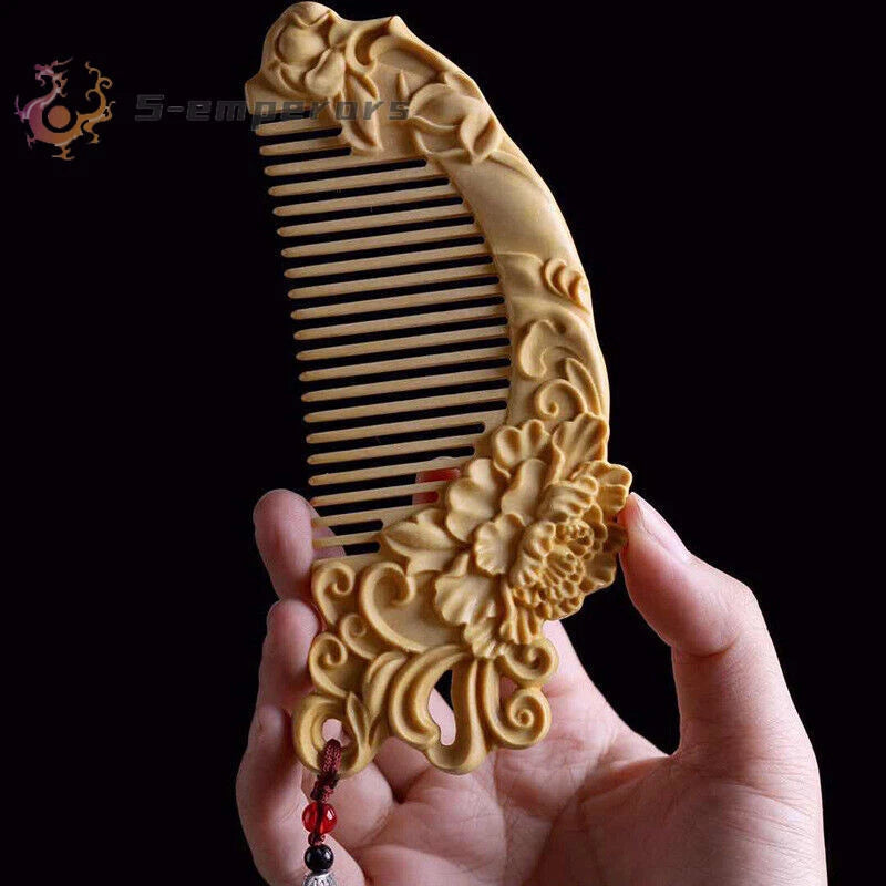Carved boxwood comb with peony flower and scroll pattern, curved handle