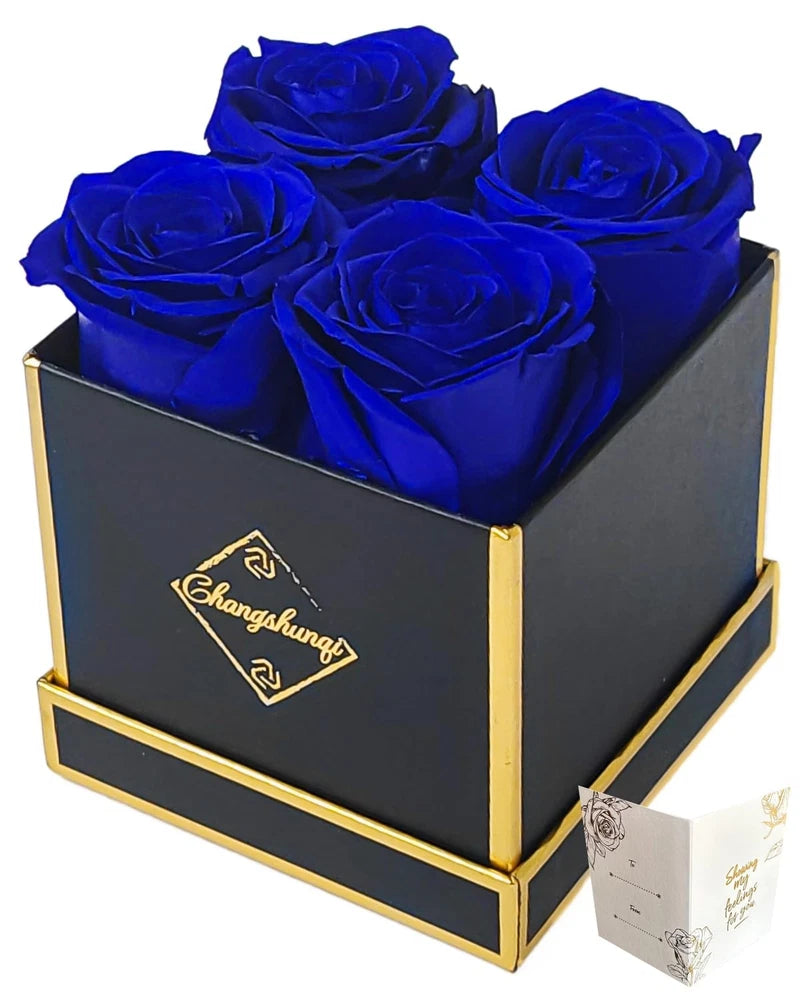 Blue preserved roses in black keepsake box with gold trim and small gift tag