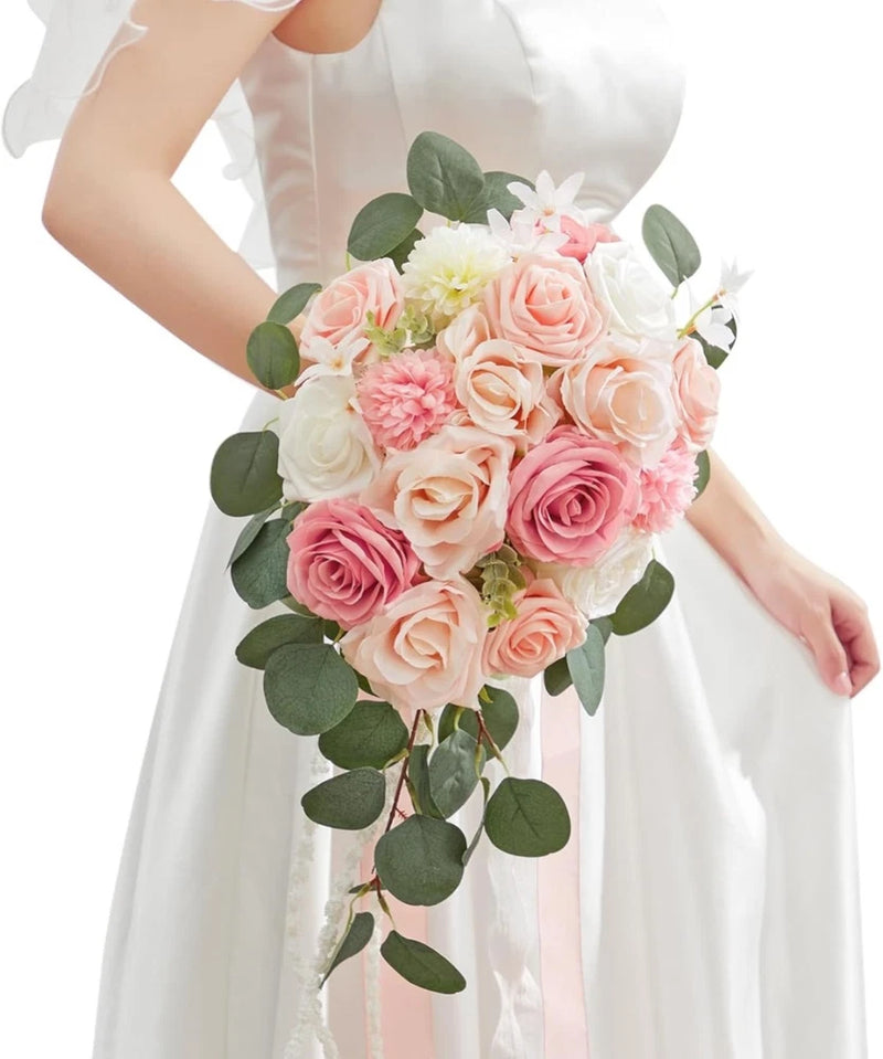 Pink and cream rose wedding bouquet with green eucalyptus leaves and pink ribbons