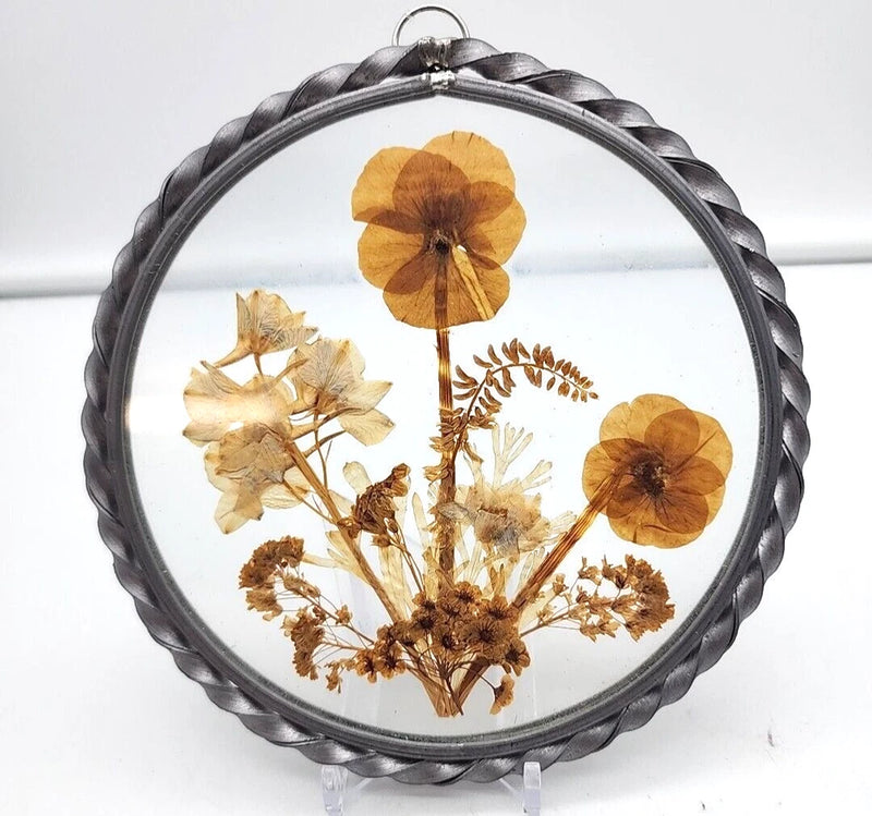Round glass dried flower frame with pewter roped border and assorted pressed blooms